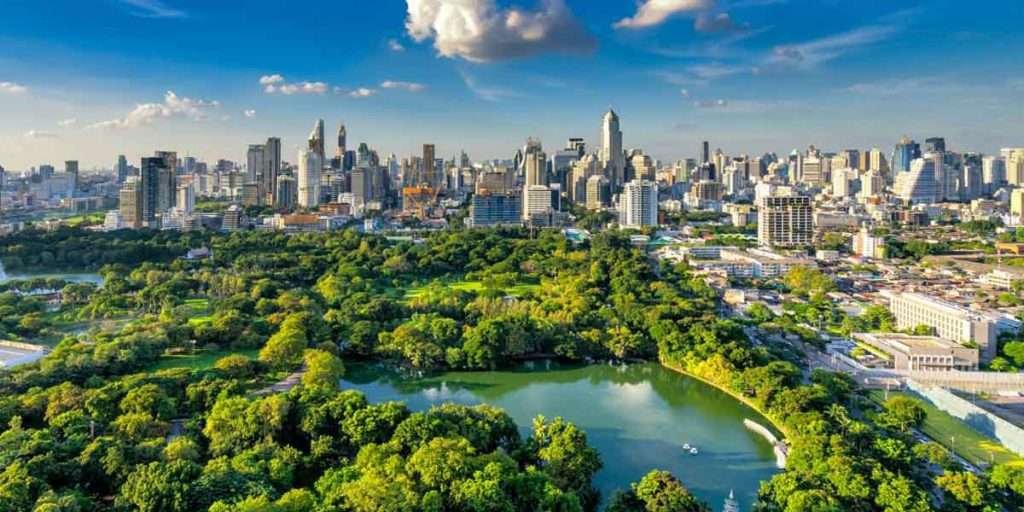 Sky Building in Bangkok with adjacent park representing eco-friendly Bfloor products